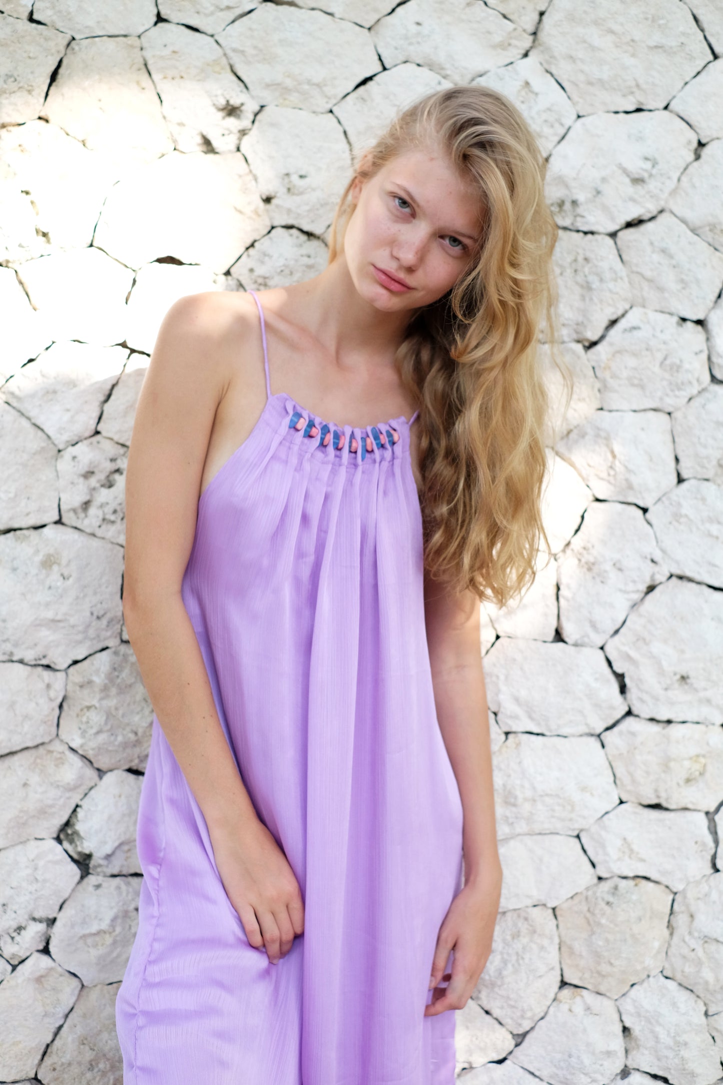 Close up front view of Angel light lilac purple halter maxi dress with beaded neckline, pleated design, perfect resort wear in Dubai, made in Bali for women who love fashion on and off the beach