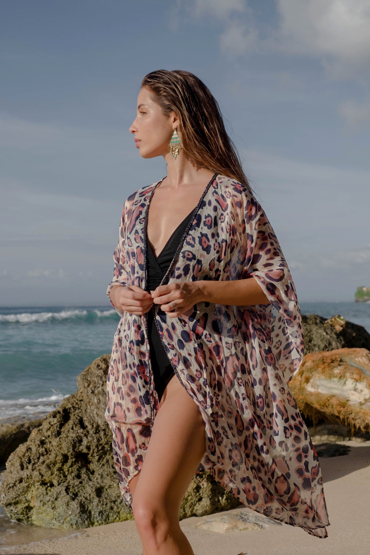 Bold navy and pink leopard print kaftan with gold accents & metallic bead neckline trim. sustainable resort wear kaftan made in Bali for women looking for modern beach coverups in Dubai