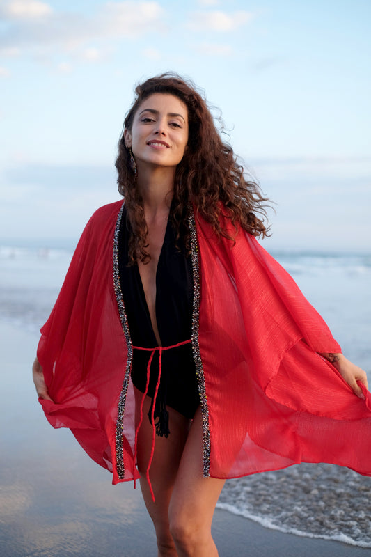 Dubai resort wear kaftan in vibrant red lurex crepe chiffon fabric with hand-sewn beads, an elegant beach cover-up for women looking for the best beach kaftans in Dubai