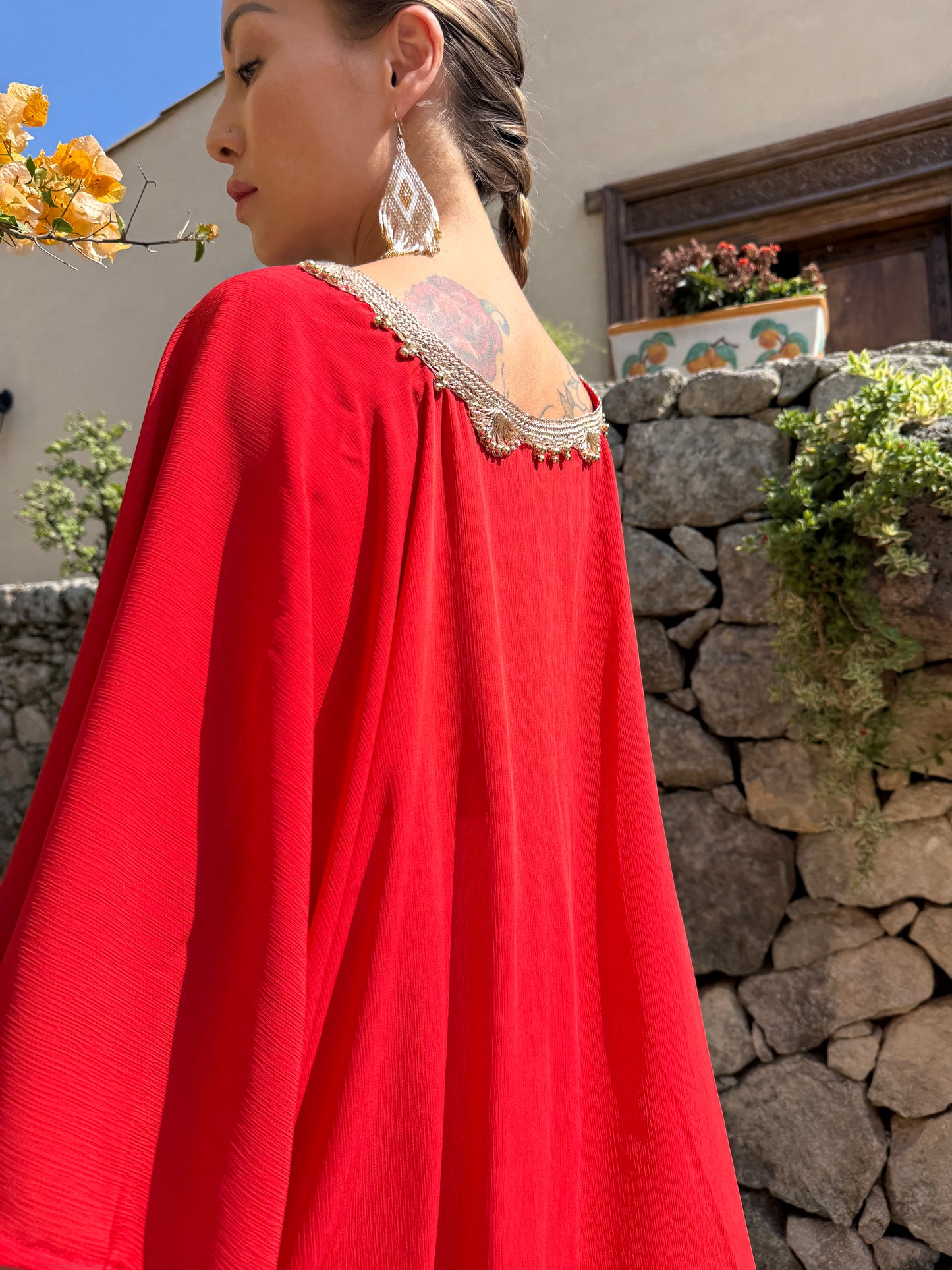 Boho luxe red beach kaftan top with gold trim as Dubai resort wear