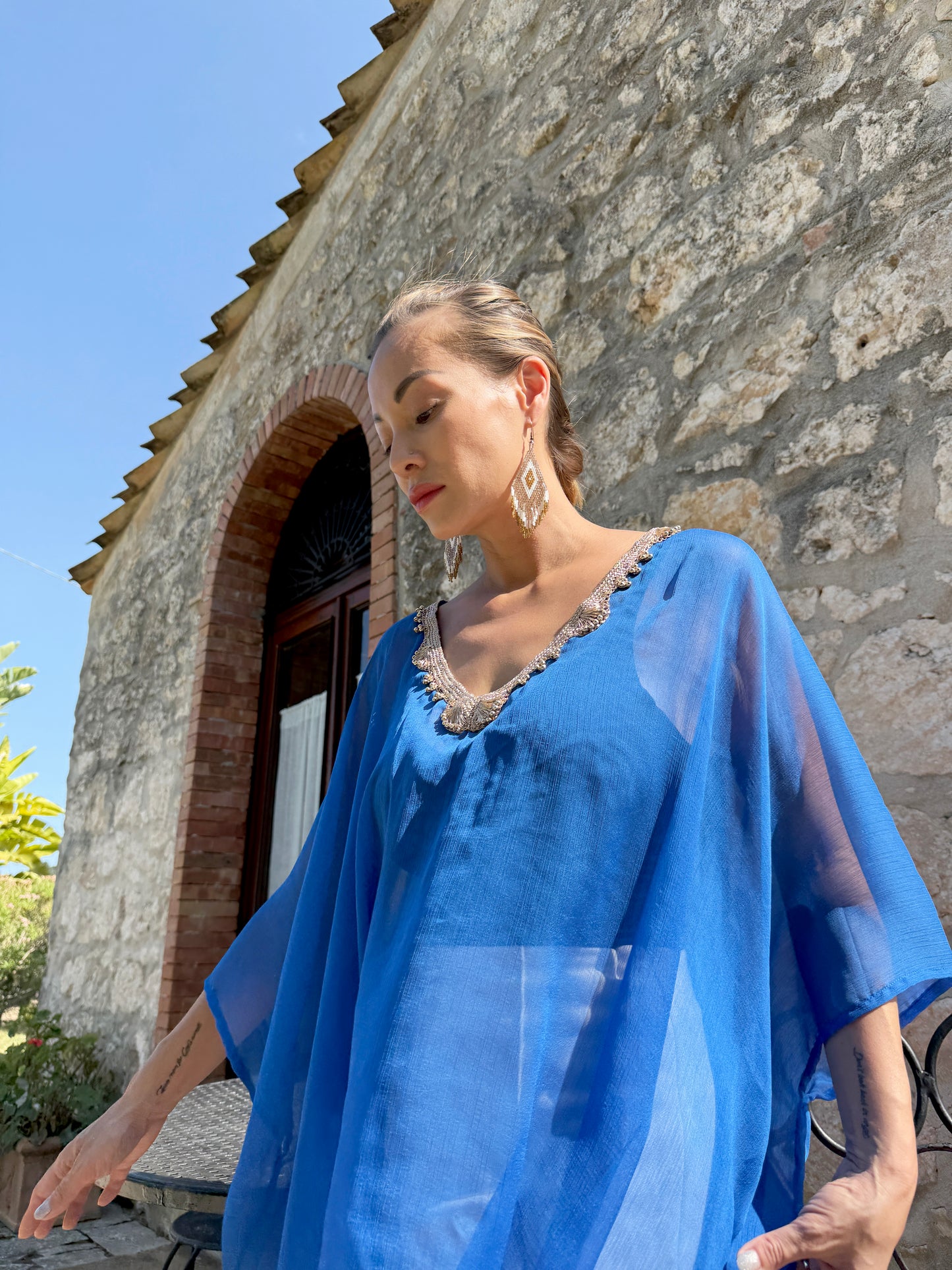 Luxury blue v neck chiffon beach kaftan cover up with artisanal gold trim for Dubai resorts