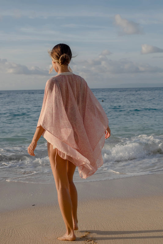 Back view of luxury Pascala pink floral chiffon women's beach kaftan, for women looking for Dubai's best beach kaftans & swimsuit cover ups