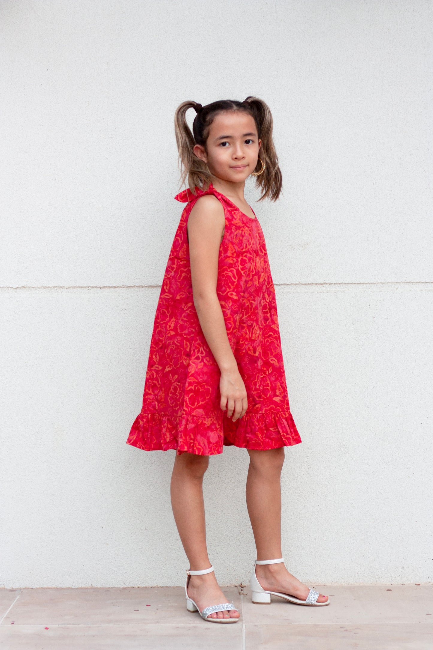 Penelope hand-stamped Indonesian cotton batik red knee-length a-line kids dress with adjustable rabbit ear shoulder ties for girls in Dubai