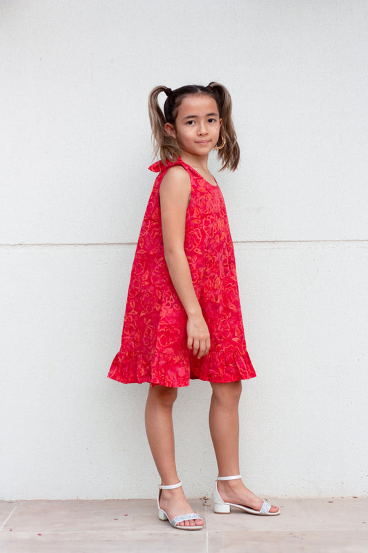 Penelope hand-stamped Indonesian cotton batik red knee-length a-line kids dress with adjustable rabbit ear shoulder ties for girls in Dubai