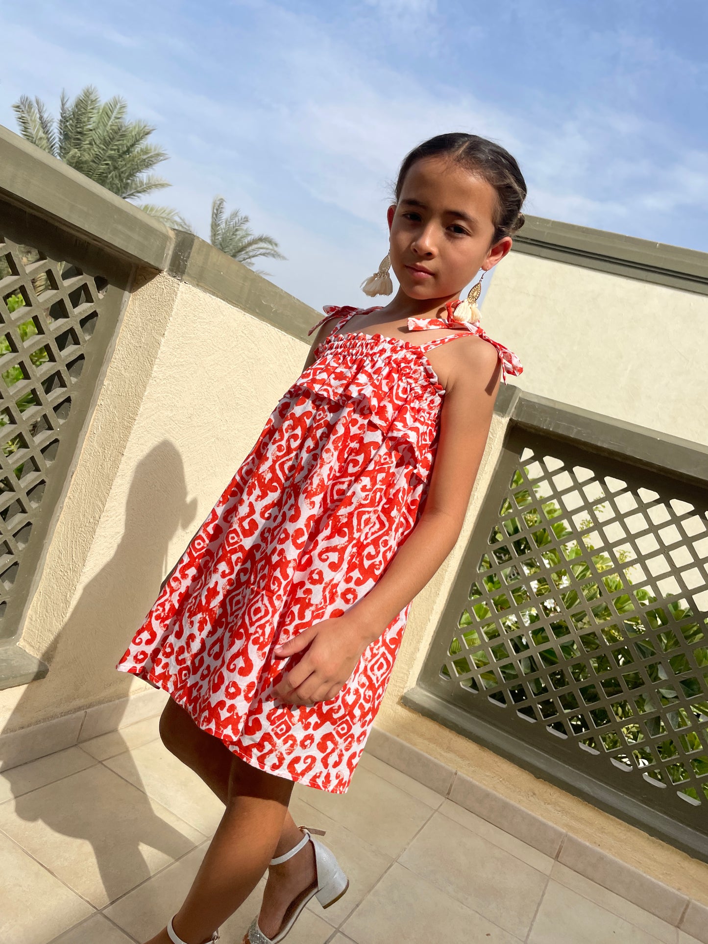 rory girls orange ikat batik dress handmade in Bali from hand-stamped artisan-made cotton, perfect summer dress for kids dubai