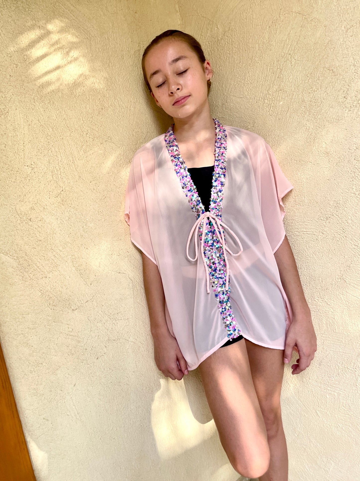 Tween girl's beach kaftan in peach pink chiffon with sequin embellishments, stylish resort wear for kids in Dubai