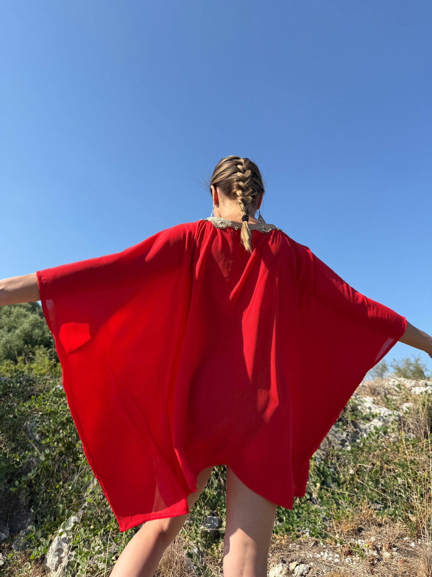 Elegant & luxurious red kaftan cover up, sustainable resort wear from Bali with gold neckline trim for women in Dubai