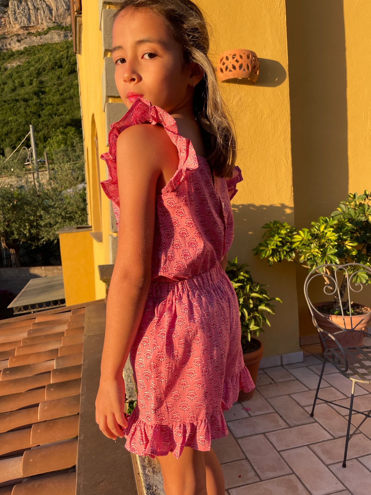 back view of Dubai girls ruffled coord set in pink floral indian block print made with plant dyes for Dubai kids.