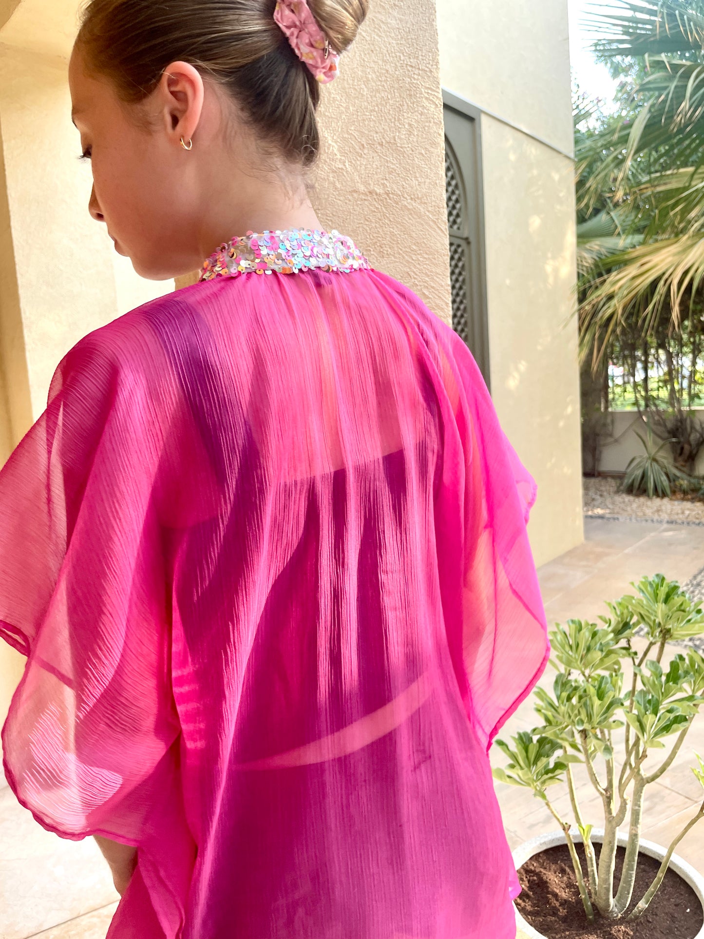 Ethical kids beach kaftan in pink chiffon with sequin details – slow-made sustainable resort wear Dubai