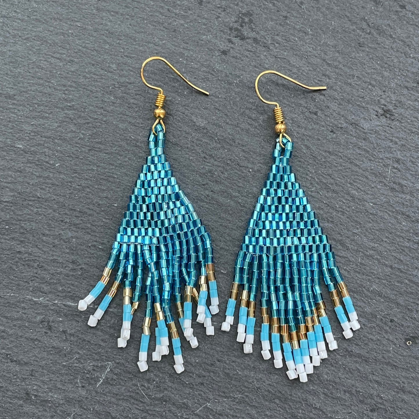 Indah handmade blue and gold beaded earrings, crafted by Bali artisans for Dubai shoppers