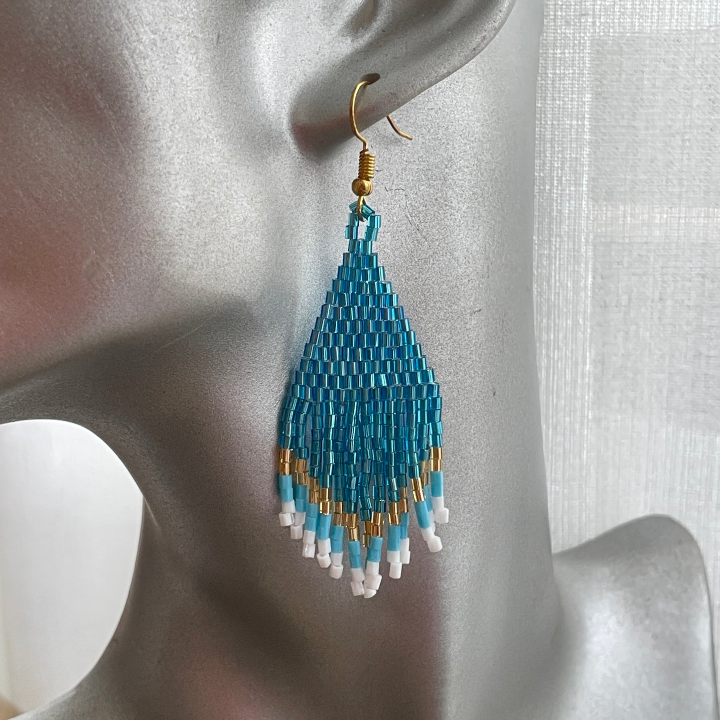 Bali artisan blue and gold statement earrings, elegant beaded jewelry for women in UAE