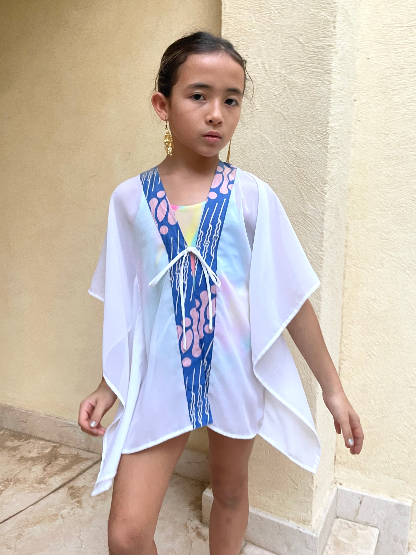 Girls' beach cover-up in white lurex chiffon with handcrafted parang batik trim, stylish and breathable resort wear.