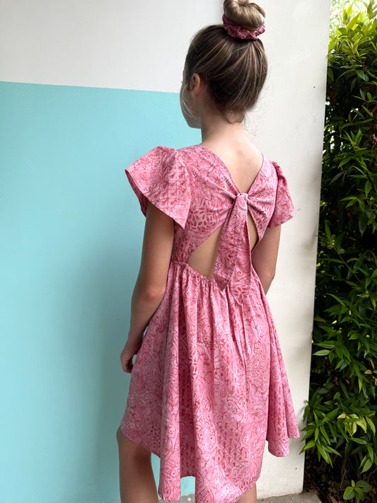 Artisan-made Ivy pink floral batik sundress for girls, ethically crafted from traditional hand-stamped batik cotton