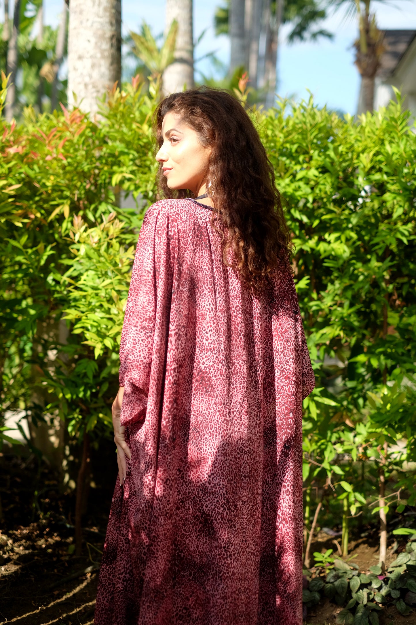 Dubai women's resort wear: Sustainable Makeba V-Neck Leopard Print Modern Beach Kaftan Dress and swimsuit cover up.