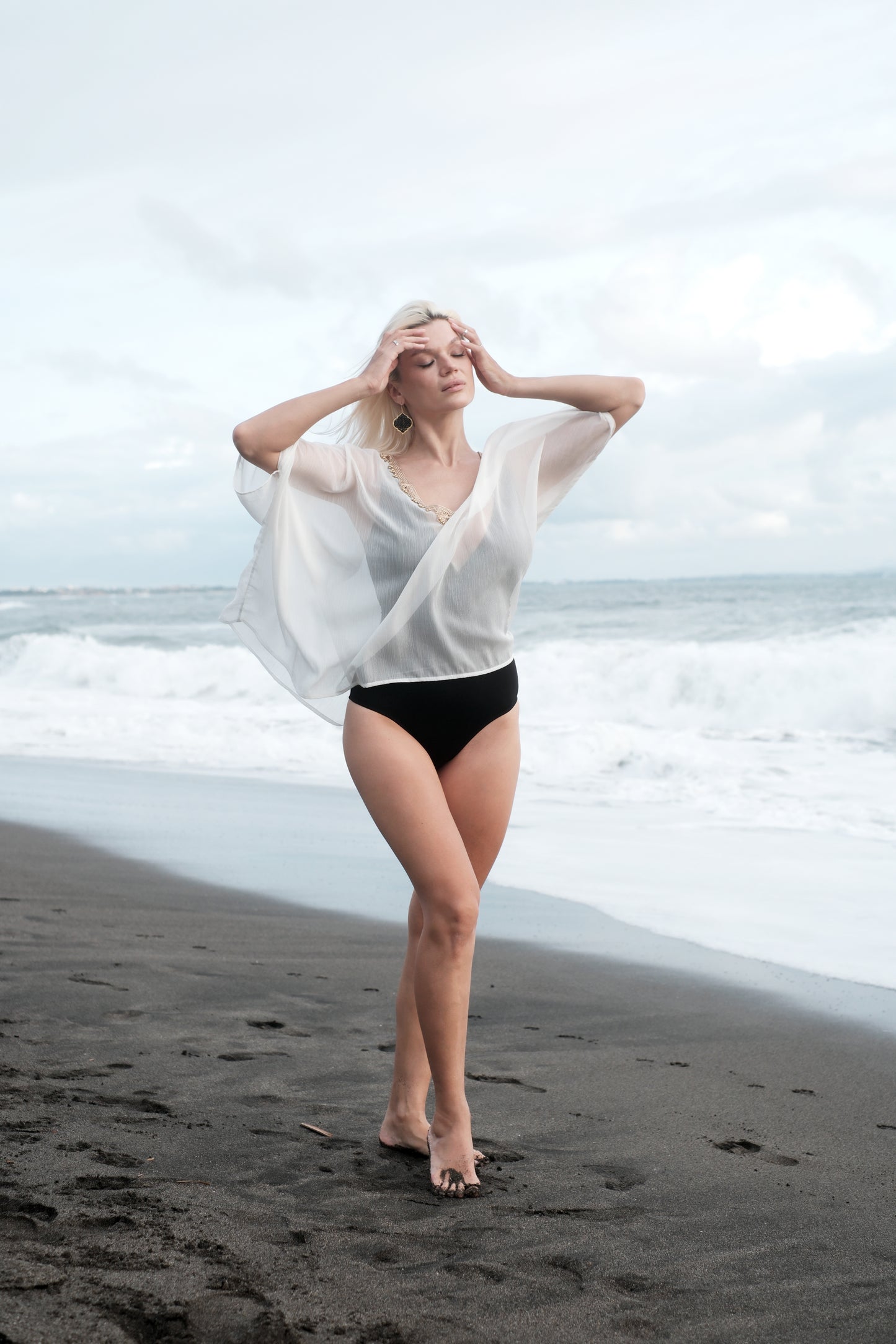 White beach kaftan with gold trim for women, sustainably made resort-style beach cover-up ideal for Dubai holidays.