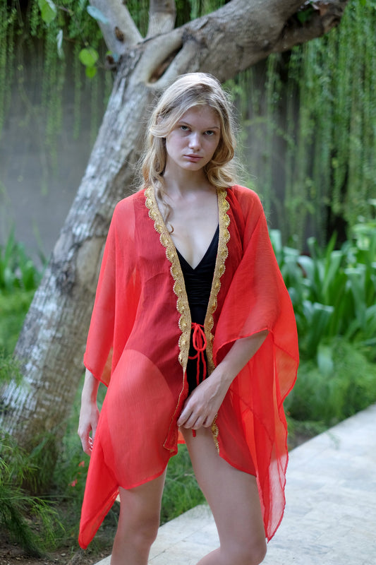 Luxurious Dubai beach cover-up with gold-trimmed neckline, sustainable beach kaftan made in Bali for women looking for best beach kaftans in Dubai