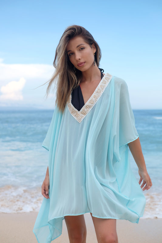 Shop the eco-friendly Sanya V-Neck Kaftan in Mint with gold embroidery, Bali-made resort wear for Dubai beach days.