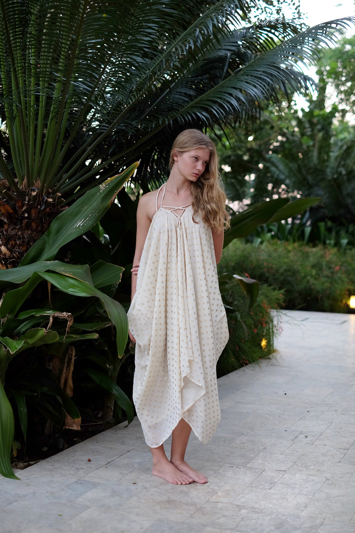 Seraphina cream and gold kaftan dress with luxurious chiffon fabric and shimmering gold detailing, offering elegant and comfortable resort style