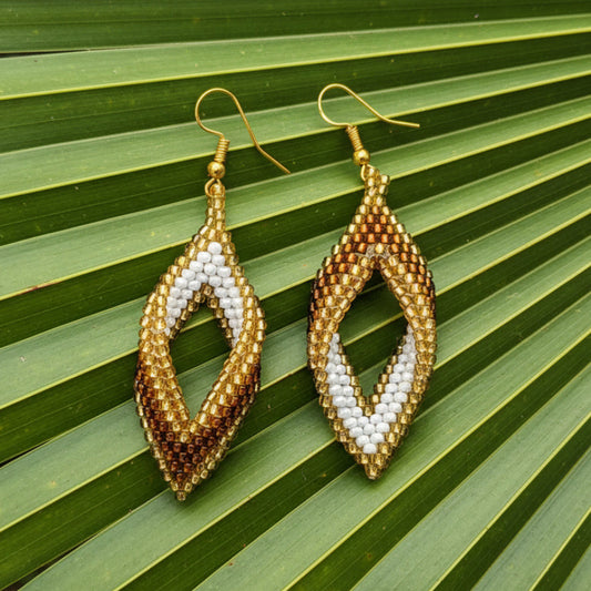 Pair of gold and white beaded leaf shaped earrings slowmade in bali for women in dubai