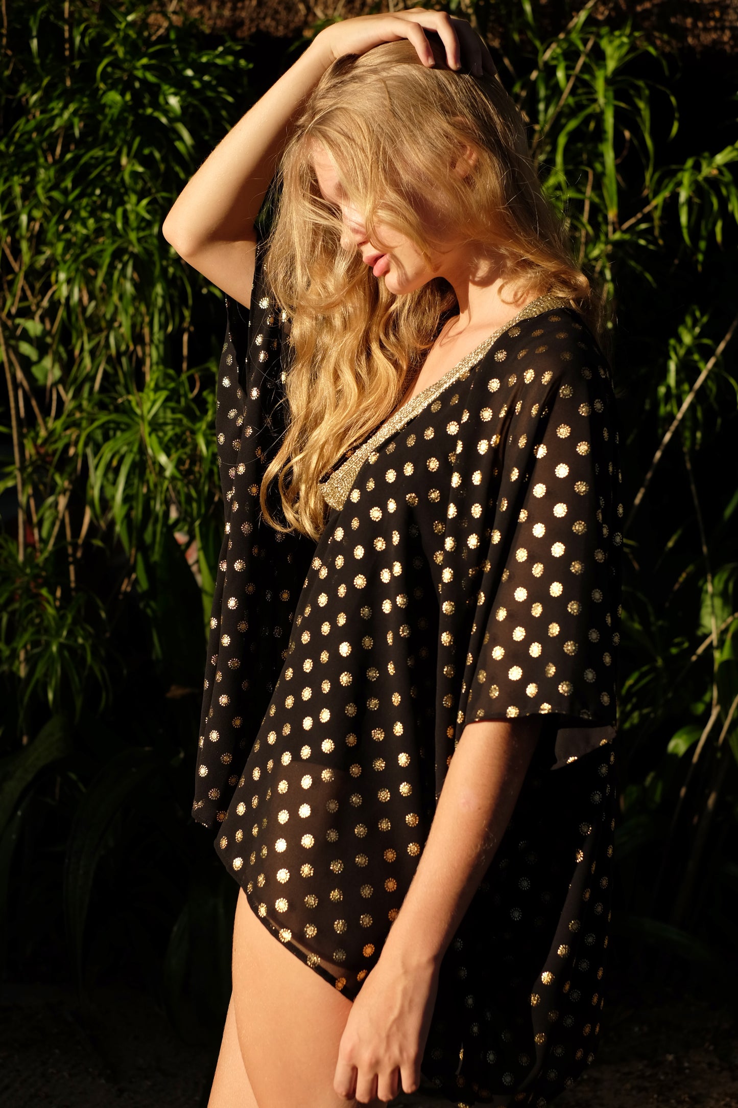 Shop Seema Black Kaftan with Indian-inspired gold motif and hand-sewn trim, eco-friendly Bali-made resort wear in Dubai.
