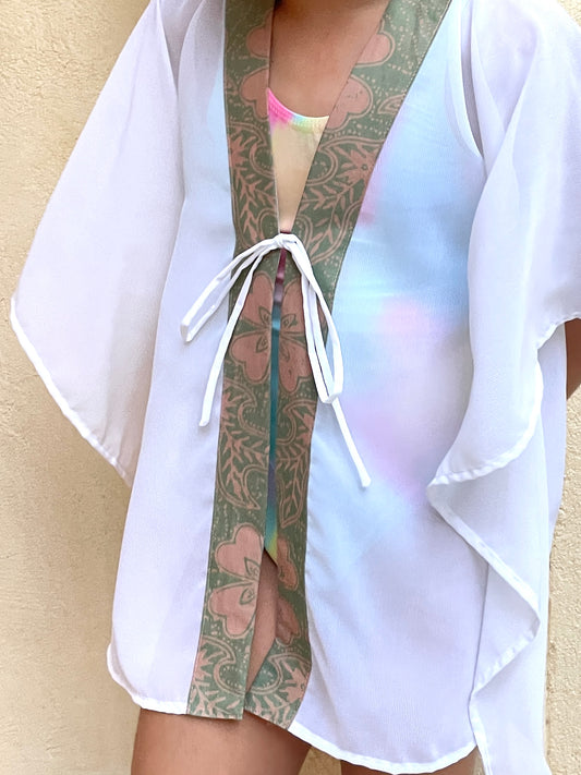 Sustainable kids kaftan with sage and pink batik trim, ideal for Dubai beach days and sunny vacations