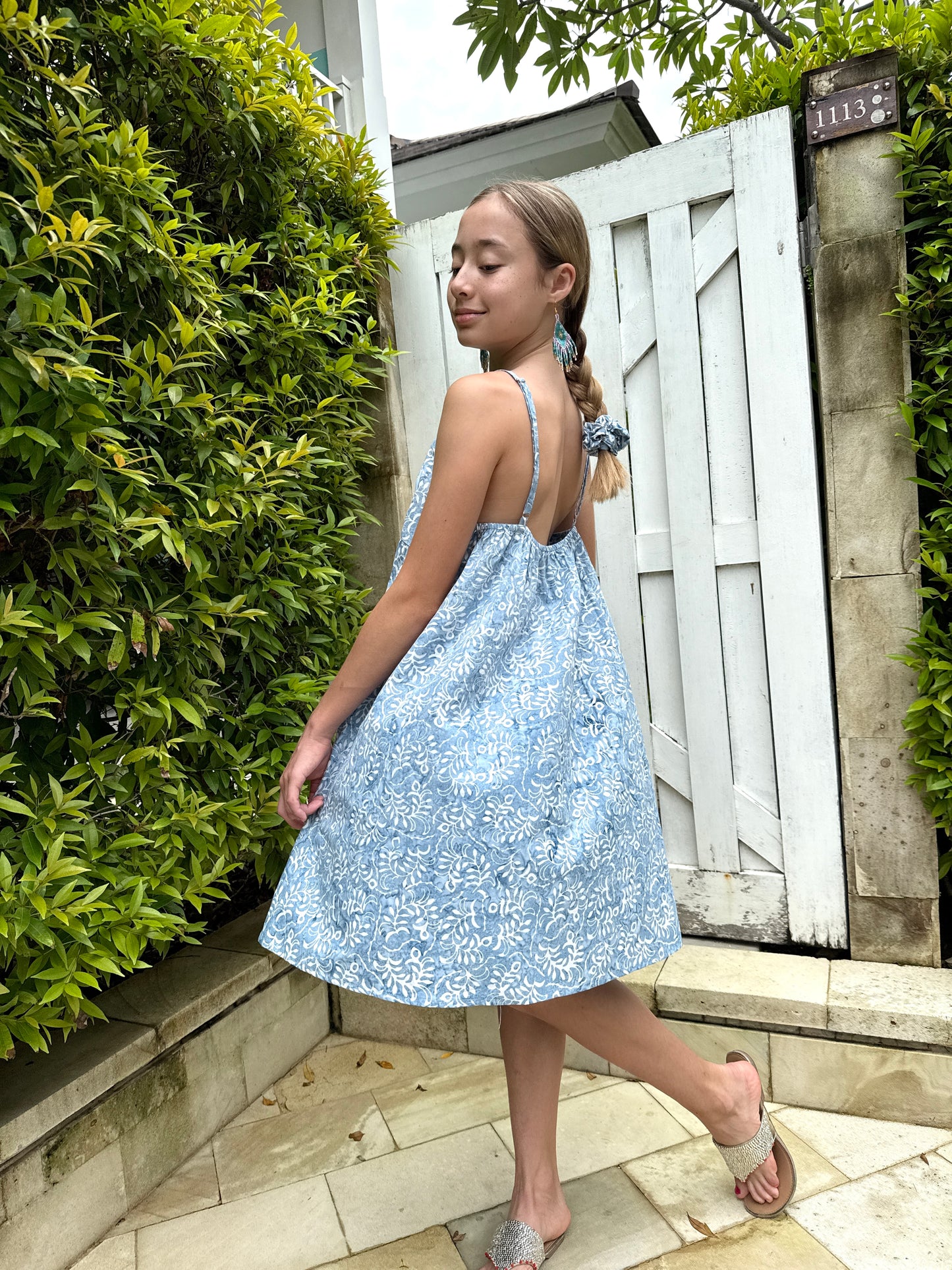Lightweight and breathable kids’ batik blue and white floral print dress perfect for beach vacations and casual dubai days out!