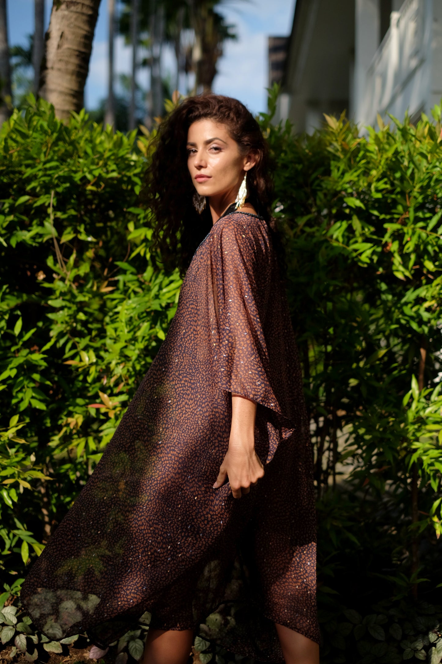 Back view of Tamala sheer leopard print resort wear beach kaftan with v-neckline and luxe detailing, perfect for Dubai fashion and holidays