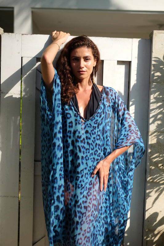 Dubai resort fashion – handmade silk chiffon beach kaftan in exotic leopard print, supporting ethical slow fashion and communities.