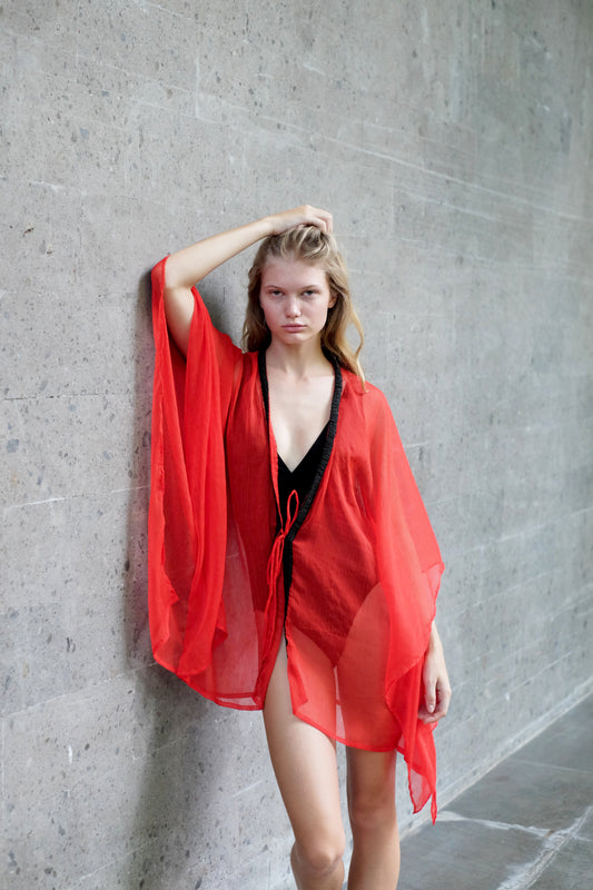 Red beach cover-up kaftan with unique hand-sewn black beads, perfect for holiday getaways in Dubai & beyond