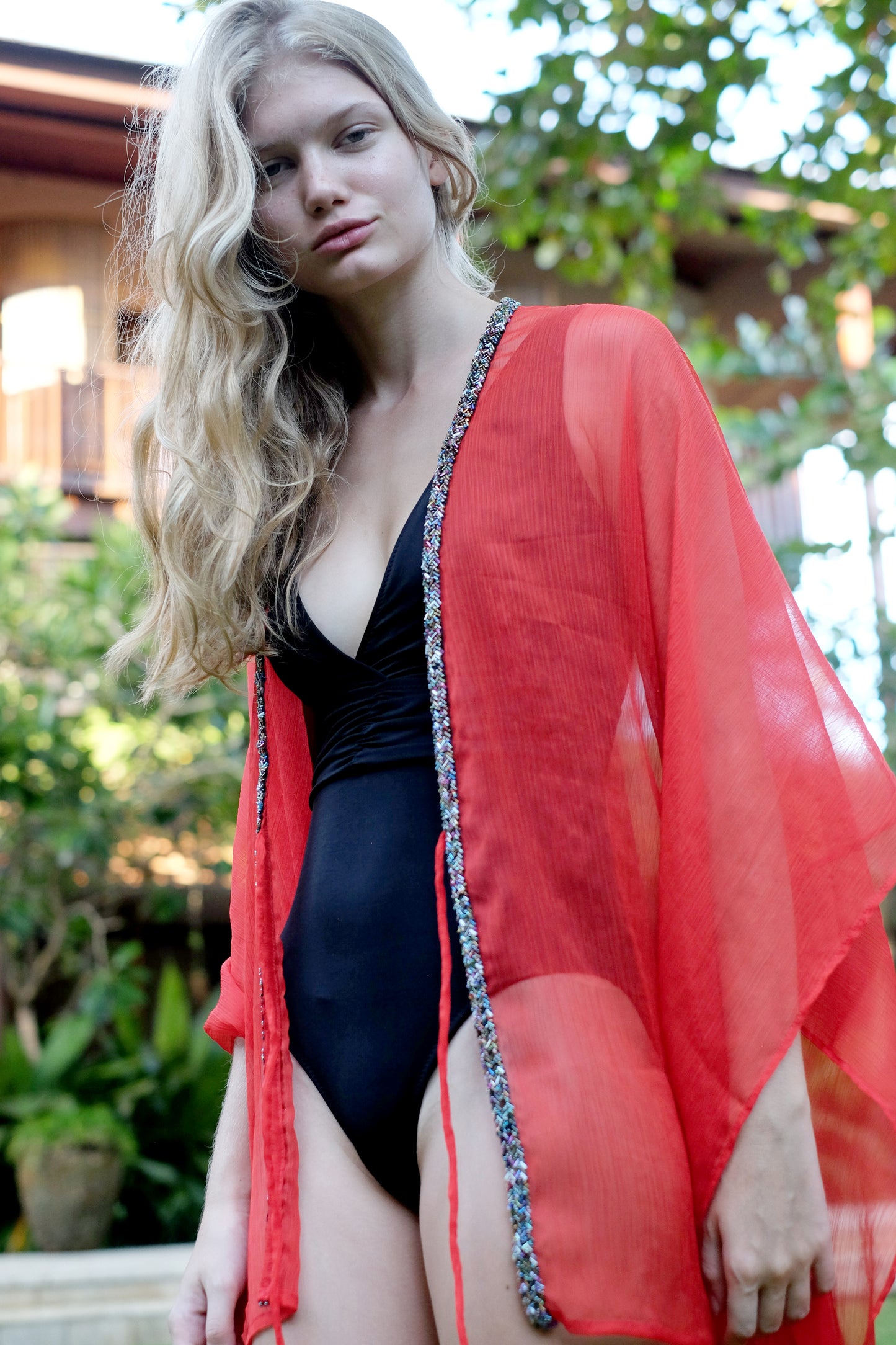 Handmade in bali women's luxury beach kaftan with artisanal beaded embellishment, for women in Dubai looking for special beach kaftan designs