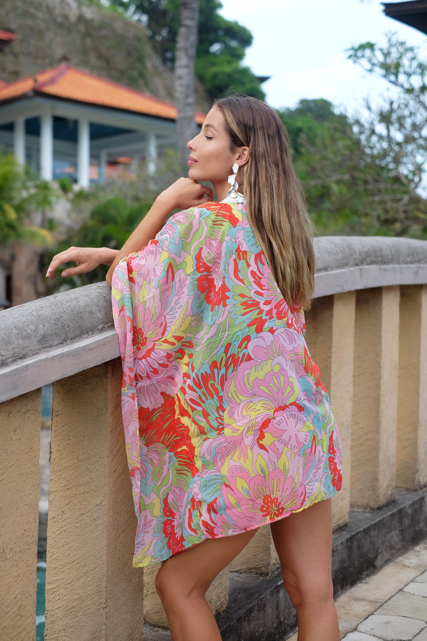 Statement resort kaftan in colorful geometric print with Pucci-inspired vibrant floral chiffon, for women with bold style looking for unique and luxury beach kaftans in Dubai