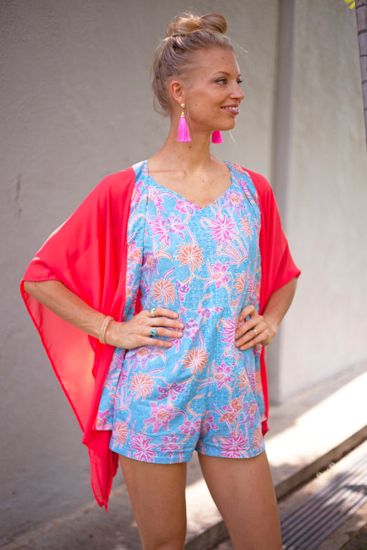 Artisan-made batik print on lightweight Ikura orange chiffon kaftan, perfect for beach days in Dubai