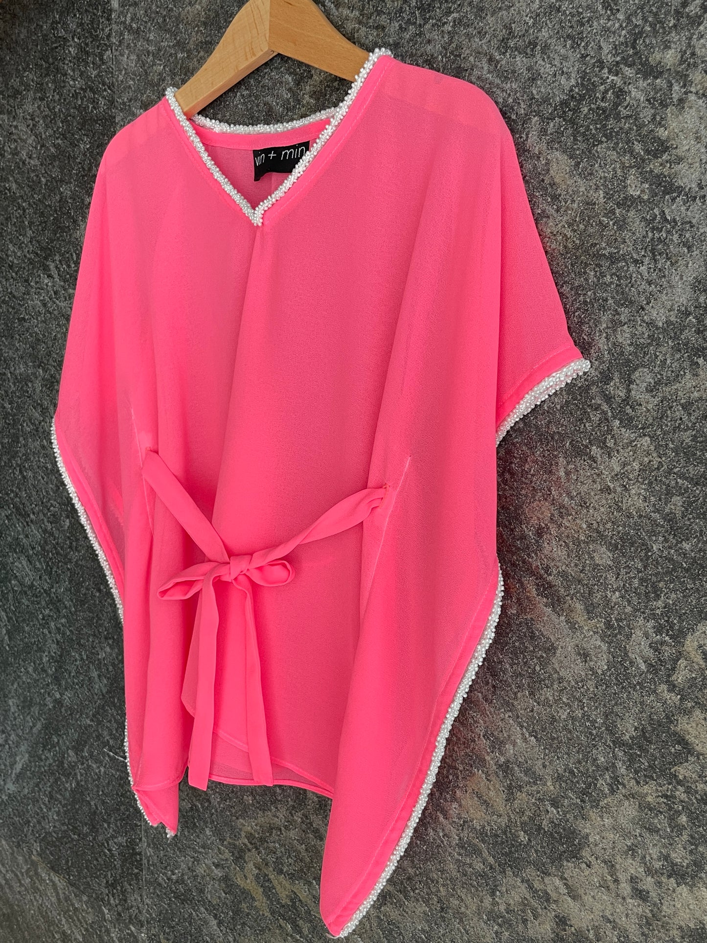 Lightweight chiffon kids beach dress in neon pink with pearly bead trim, handmade in Bali