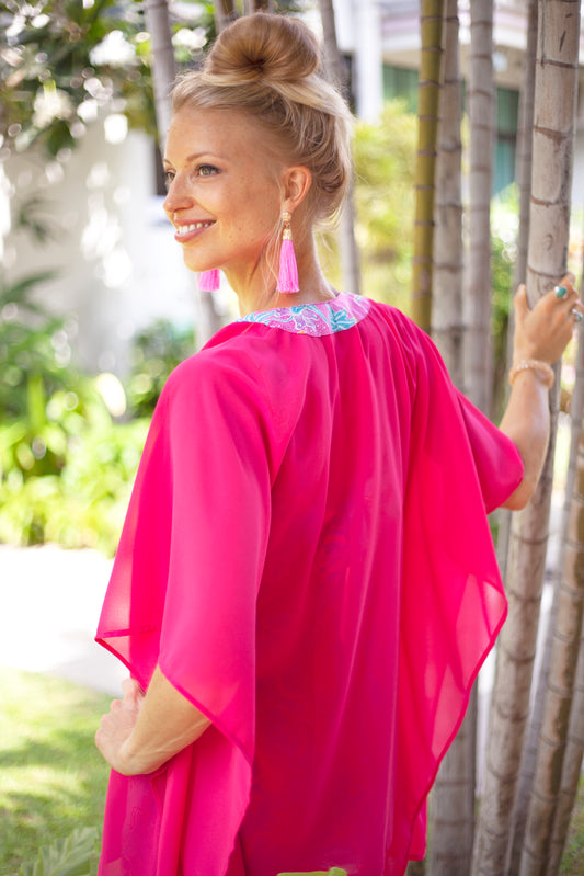 Stylish and breathable resort wear kaftan in rose pink with traditional Indonesian batik neckline accent, for women looking for unique beach kaftans in Dubai