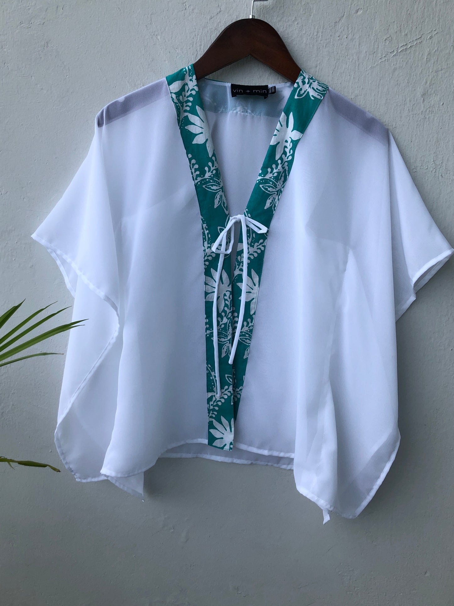 Bali-made children's beach cover-up in shimmering lurex chiffon with vibrant green batik trim, for girls in Dubai