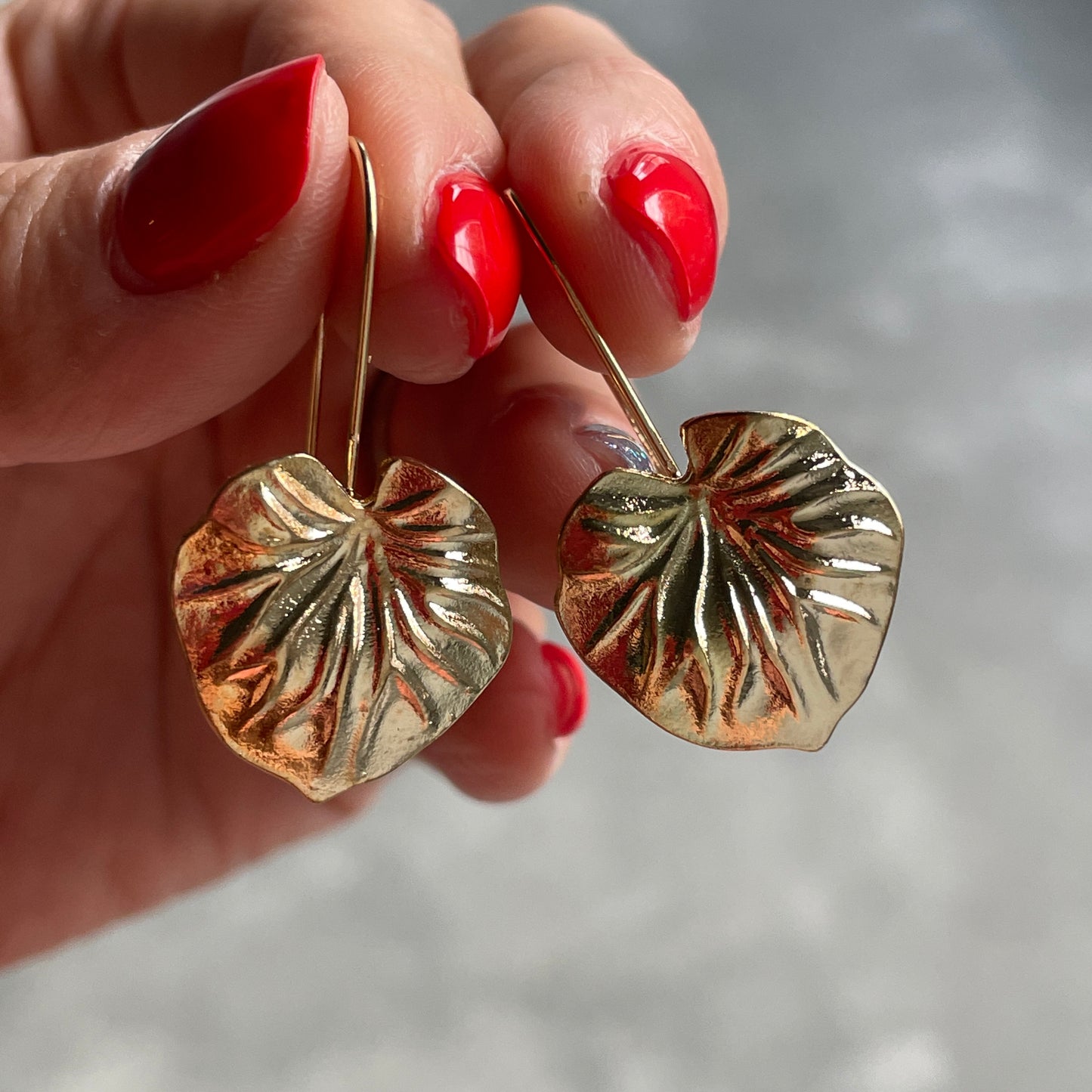 Lily gold leaf dangle earrings for women in Dubai, made from lightweight alloy