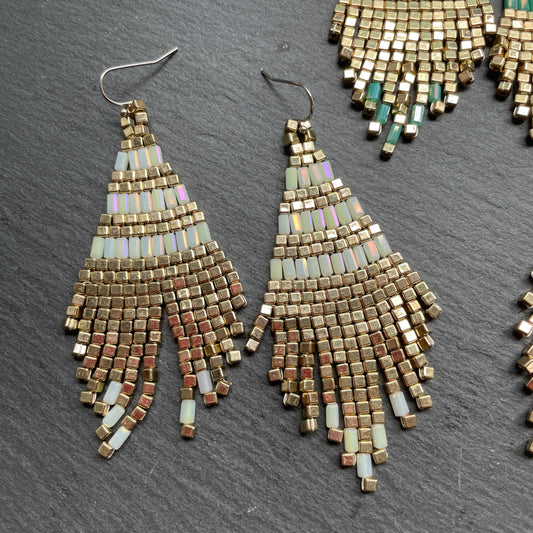 Handmade pearl and gold earrings, artisan-crafted in Bali, ethical fashion accessory for Dubai women.