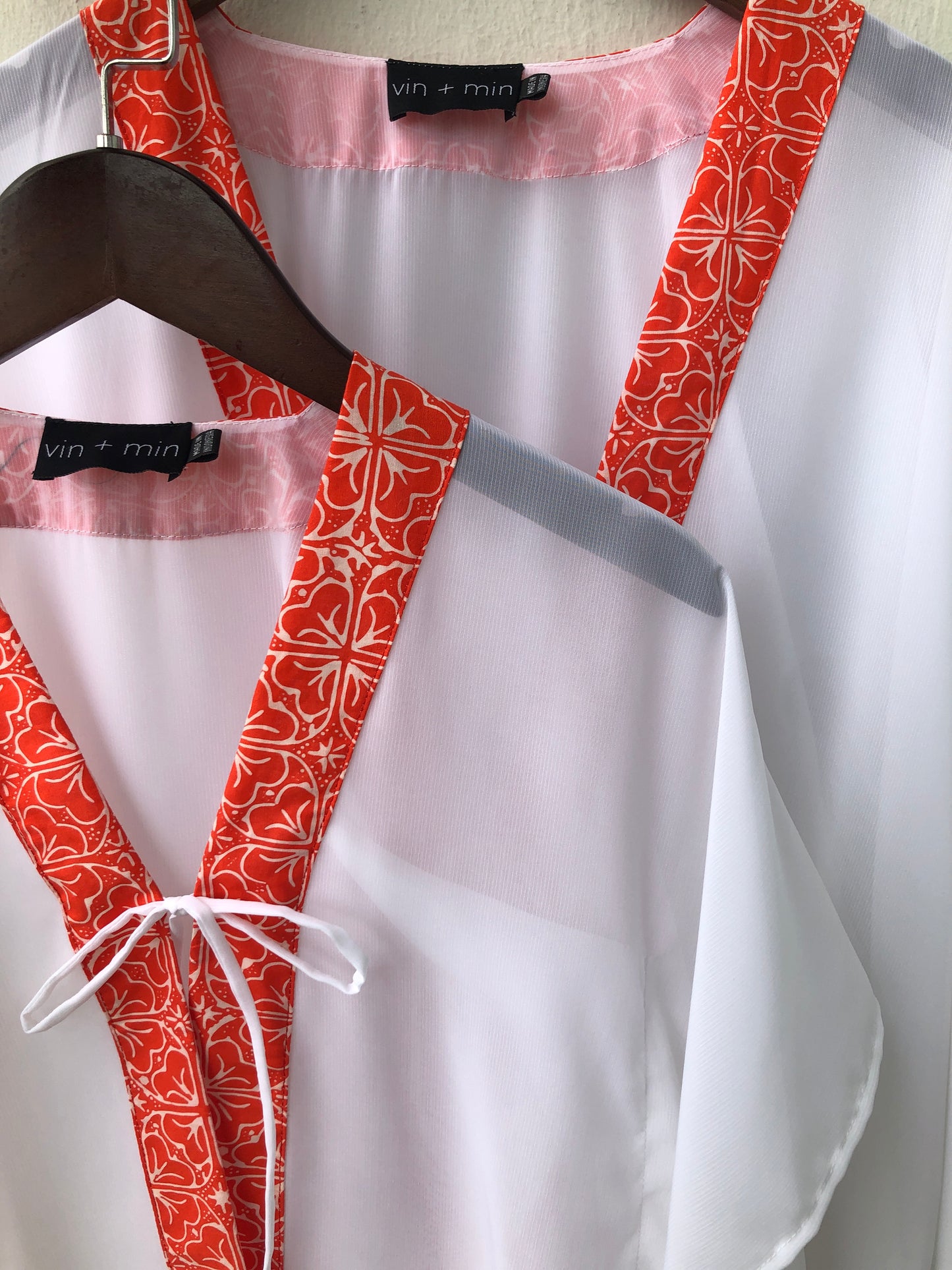 Onism orange floral batik kaftan, a handmade kids cover-up for beach fun also available in a matching mommy version, for sale in Dubai