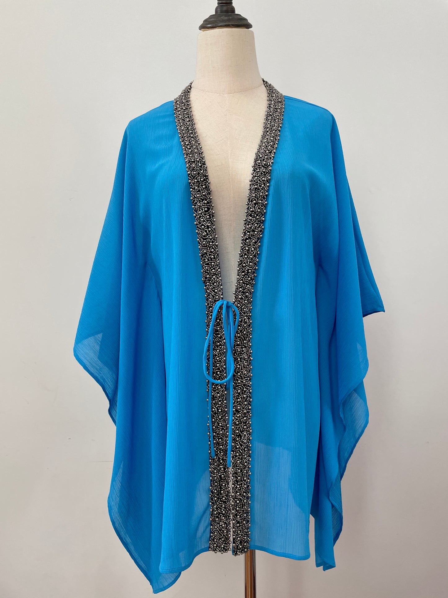 Hand-sewn beaded beach cover-up in blue – perfect for poolside glam in Dubai and beyond