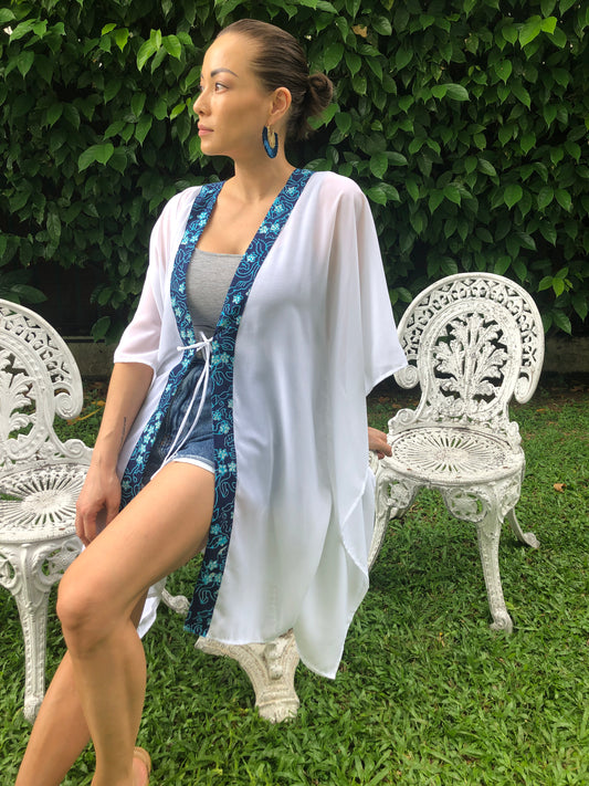 Chic white chiffon beach cover-up with unique hand-stamped batik trim, sustainable & stylish for luxury Dubai getaways