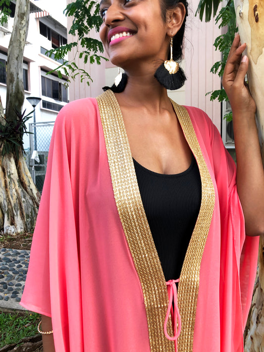 Elegant salmon pink Valeria kaftan for women, featuring luxurious chiffon fabric and gold accents, ideal for beach days in Dubai