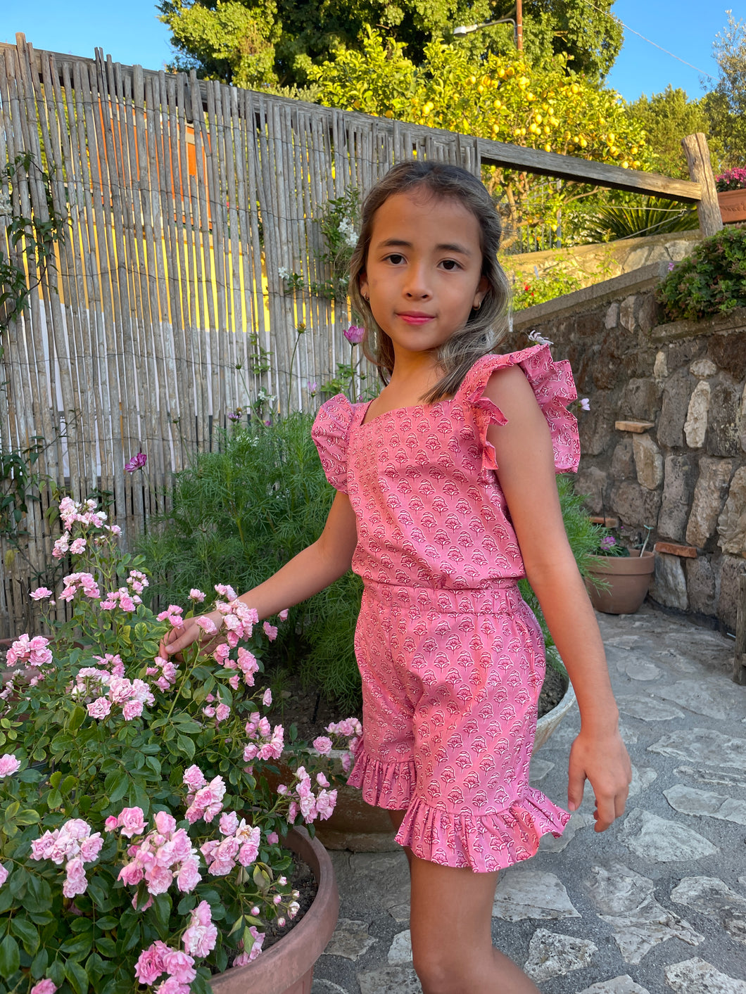 Girls rose pink floral set with ruffled sleeves and shorts, made from handmade Indian block print, handmade in India, for sale in Dubai