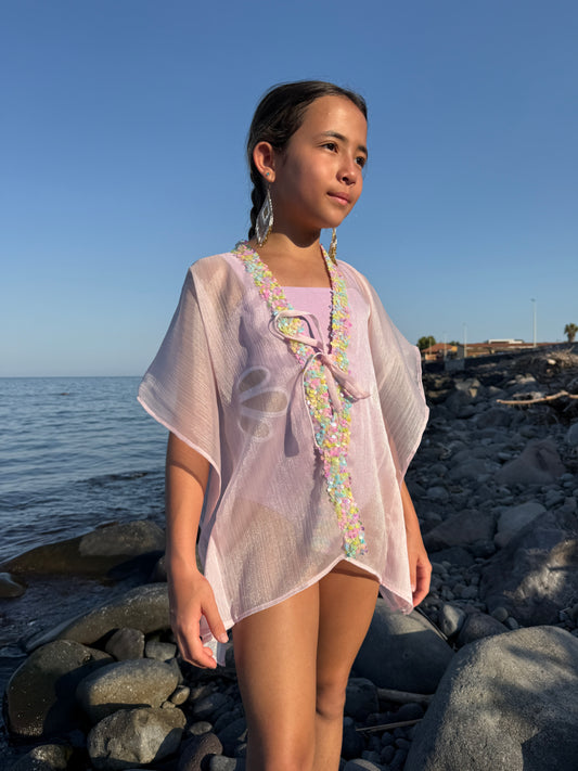 Girl in shimmery purple beach kaftan with light rainbow colored sequins along the neckline, beachwear for Dubai girls and kids