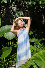 Load image into Gallery viewer, Half body length photo of light blue ombre halter maxi resort style dress with beading along the neck and back lines, pleated design, perfect for resort wear in Dubai for women who love sustainable fashion