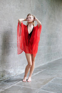 slow fashion, sustainable women's beach kaftan in red, ideal as a beach cover-up or evening resort outfit in Dubai