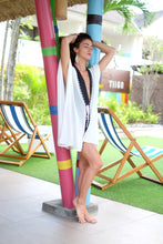 Load image into Gallery viewer, Elegant, modern white Dione beach kaftan with metallic silver and black beaded neckline for women in Dubai looking for the best beach kaftans
