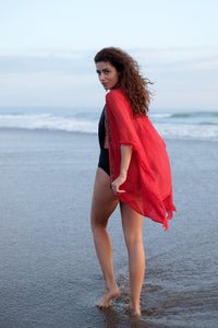 Handmade beaded beach kaftan in red lurex chiffon and hand-sewn bead neckline trim – a must-have swim cover-up for Dubai, sustainably beachwear for women looking for unique and glamorous beach kaftans in Dubai
