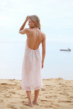 Load image into Gallery viewer, A back view of the Mimi dress in light pink floral, highlighting the adjustable neck ties, low back design, and the elegant fall of the fabric.