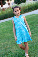 Load image into Gallery viewer, The Penelope Girls Batik Sundress in Blue Polka Dots, sustainably made in Bali. Hand-stamped batik, A-line silhouette, and adjustable ties. Perfect summer dress for girls in Dubai!