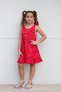 Penelope hand-stamped Indonesian cotton batik red knee-length dress with adjustable rabbit ear shoulder ties for girls in Dubai